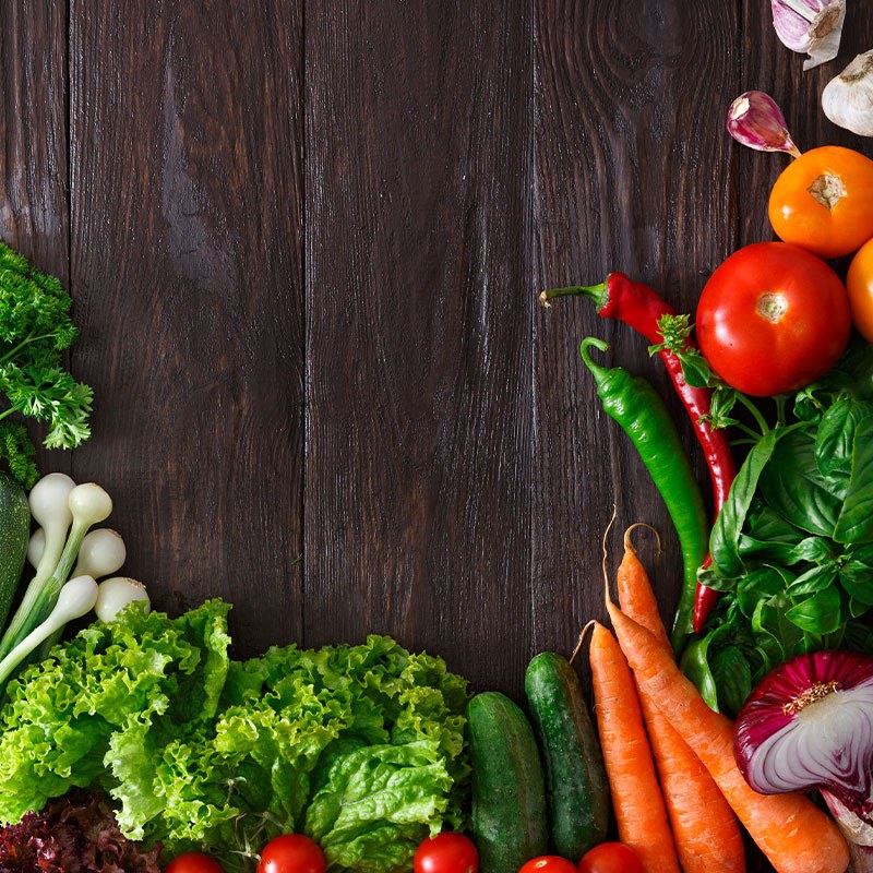 Assorted Produce Sping Onion Lettuce Tomatoes Cucumbers Carrots Green Chili Pepper Red Chili Pepper Basil Red Onion and Garlic